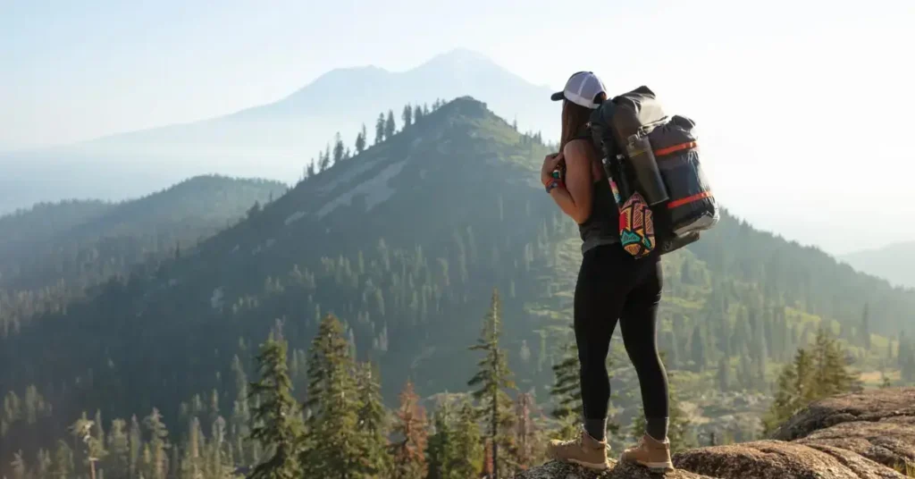 Women Hiking Outfit Summer. Women with a Backpack.